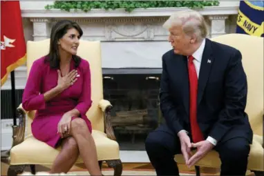  ?? EVAN VUCCI — THE ASSOCIATED PRESS ?? President Donald Trump meets with outgoing U.S. Ambassador to the United Nations Nikki Haley in the Oval Office of the White House, Tuesday in Washington.