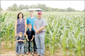  ?? LYNN KUTTER ENTERPRISE-LEADER ?? The Moore family of Lincoln grows field corn, in the background above, and soybeans. They were named 2017 Washington County Farm Family of the Year.