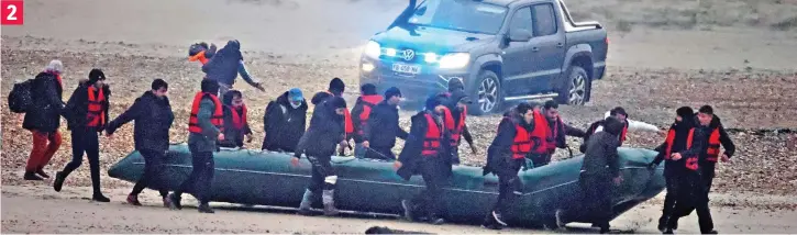  ?? ?? As a French police vehicle drives towards them, its headlights cutting through the early morning mist, a mother with a small child screams at the officers inside