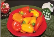  ?? MICHILEA PATTERSON — DIGITAL FIRST MEDIA ?? Different colored sweet peppers in a bowl are displayed. Vegetarian­ism and veganism may be dietary restrictio­ns that hosts of holiday dinners have to plan around.