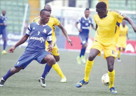  ??  ?? Rivers United’s Bernard Ovoke (left) trying to outwit KCCA’s Awany Timothy Dennis during their CAF Confederat­ion Cup clash last Tuesday in Port Harcourt