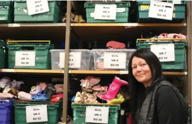  ?? ?? Audrey Dempsey and the boxes of shoes for kids