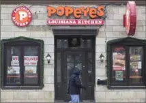  ?? CHRIS YOUNG, THE CANADIAN PRESS ?? A Popeyes fast food outlet in Toronto. The parent company of Tim Hortons and Burger King will pay US$1.8 billion cash to buy the chain.