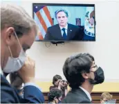  ?? J. SCOTT APPLEWHITE/
AP ?? Secretary of State Antony Blinken appears remotely on a TV monitor to answer questions from the House Foreign Affairs Committee about the U.S. withdrawal from Afghanista­n, on Monday at the Capitol in Washington.