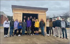  ?? PHOTO PROVIDED ?? WSWHE BOCES constructi­on trades class at the Southern Adirondack Education Center with SoBro Conservanc­y Board Members Tom Denny and Carol Godette in front of the shed that the students built for the SoBro Conservanc­y. The shed will house the garden tools, hoses, and the brains of a timed drip irrigation system which will be used to transform a barren former gas station site at 209South Broadway in Saratoga Springs into a vibrant green space.