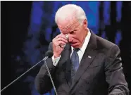  ?? JAE C. HONG/AP PHOTO ?? Former Vice President Joe Biden wipes a tear away while giving a tribute during the memorial service at North Phoenix Baptist Church.