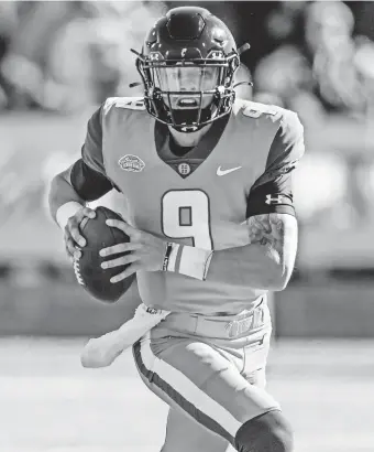  ?? BUTCH DILL/AP ?? Desmond Ridder scrambles during the Feb. 5 Senior Bowl in Mobile, Alabama. Ridder was 4-for-6 for 68 yards and two TD passes in the game.