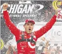  ?? AP ?? Driver Kyle Larson celebrates after his win Sunday at Michigan Internatio­nal Speedway, his first NASCAR victory after 99 career starts over three years.