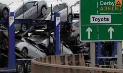  ?? Photograph: Darren Staples/Reuters ?? New Toyota cars are transporte­d from their manufactur­ing facility in Burnaston. The plant’s boss says an assessment will be made at the end of the year about its future.