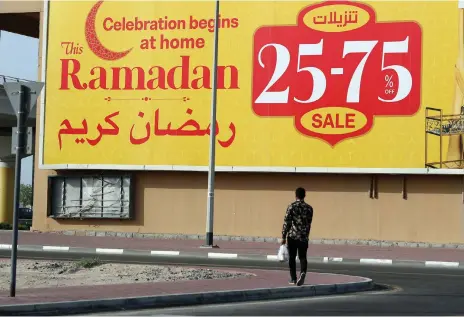  ?? Chris Whiteoak / The National ?? A Ramadan sales billboard in Dubai. There are bargains to be had, especially at the end of the holy month