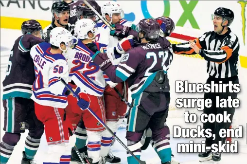  ?? USA TODAY Sports ?? DODGE, DUCK! The Rangers’ Will Cuylle, Jonny Brodzinski and Blake Wheeler scuffle with Ducks players, including Mason McTavish (23), during the second period on Sunday night at Honda Center. The Blueshirts trio had a strong game in their team’s 5-2 victory.