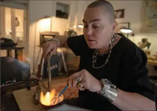  ?? HILARY SWIFT, NYT ?? Jelena Behrend, a Serbian-born jewelry designer, at work in her studio in New York.