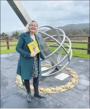  ?? ?? Local author Cathy Fitzgibbon, at the sundial on the grounds of the Nano Nagle Centre, Killavulle­n.