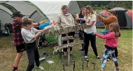  ?? PAUL MITCHELL/STUFF ?? The Carters and Clarks prepare for their annual water fight with another camping family. From left: Jacob Carter, 10, Poppy Derbidge, 11, Katrina Carter, Charlotte Carter, 12, Taryn Derbidge, 15, Cherie Clark, and Ryleigh Carter, 7.