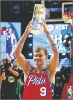  ?? RICK BOWMER/AP ?? MAC MCCLUNG of the Philadelph­ia 76ers reacts after winning the slam dunk competitio­n of the All-star weekend on Saturday in Salt Lake City.