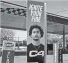  ?? FRED SQUILLANTE/COLUMBUS DISPATCH ?? Ohio State quarterbac­k C.J. Stroud appears on a C4 Energy drink ad at a Sunoco gas station in Columbus.