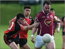  ??  ?? O’Connell’s Conor Culligan is challenged by Paul Duff.