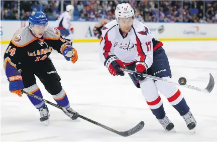  ?? PAUL J. BERESWILL/THE CANADIAN PRESS ?? Former Washington Capitals winger Wojtek Wolski, right, offers one of the more poignant stories among the players named to Canada’s Olympic team on Thursday. Wolski, who now plays in the KHL, is coming off a serious neck injury suffered last season.