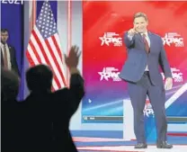  ?? STEPHEN M. DOWELL/ORLANDO SENTINEL ?? Gov. Ron DeSantis waves to the crowd at CPAC at the Hyatt Regency in Orlando on Friday.