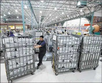  ?? Robert Gauthier
Los Angeles Times ?? Ballots are received, sorted and verified at the L.A. County ballot processing facility on Wednesday. They are then shipped to Norwalk to be counted. Rep. Karen Bass took a small lead over Rick Caruso on Friday on the race for L.A. mayor.