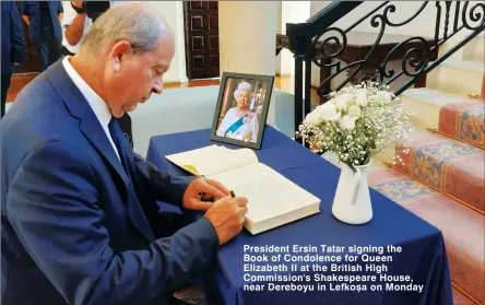  ?? ?? President Ersin Tatar signing the Book of Condolence for Queen Elizabeth II at the British High Commission's Shakespear­e House, near Dereboyu in Lefkosa on Monday