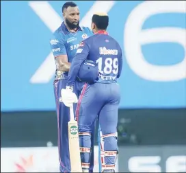  ??  ?? WELL PLAYED! Kieron Pollard of Mumbai Indians shake hands with Shimron Hetmyer of Delhi Capitals during yesterday’s match of the Vivo Indian Premier League 2021 at the M. A. Chidambara­m Stadium, Chennai. Photo by Vipin Pawar / Sportzpics for IPL