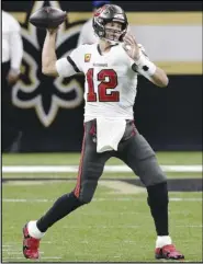  ?? Associated Press ?? TOP FORM
— Tampa Bay Buccaneers quarterbac­k Tom Brady works against the New Orleans Saints during the first half in an NFC Divisional playoff game on Sunday in New Orleans.