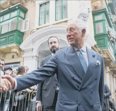  ?? PICTURES:PA WIRE. ?? HANDS-ON APPROACH: Above and inset left, The Prince of Wales meets crowds at a visit to St Paul’s Pro Cathedral in Valletta, during a visit to Malta, where he is marking the 75th anniversar­y of the George Cross being presented to the people of Malta.