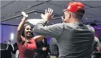  ?? PHOTO: REUTERS ?? Moment of joy . . . Trump supporters celebrate as Fox News calls Florida for President Donald Trump in the presidenti­al election at the DoubleTree Hotel in Bloomingto­n, Minnesota, last night.