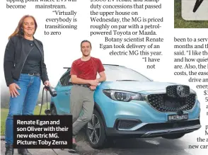  ?? ?? Renate Egan and son Oliver with their new electric MG. Picture: Toby Zerna