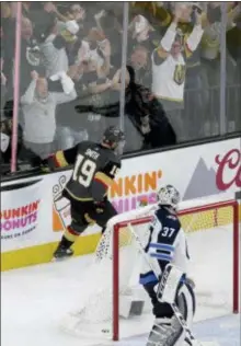  ?? MARC SANCHEZ — THE ASSOCIATED PRESS ?? Vegas’ Reilly Smith celebrates after scoring past Winnipeg goaltender Connor Hellebuyck during the period of Game 4 of the Western Conference finals in Las Vegas. third Friday