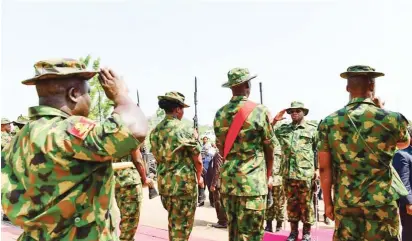  ?? Photo: Kogi Govt. House ?? Governor Yahaya Bello of Kogi State (2nd right) inspects a guard of honour mounted by soldiers deployed to the state for the ‘Operation Cat Race’ exercise, during his visit to the camp at Irepeni village, along the Lokoja-Okene highway on Tuesday.