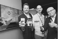  ??  ?? Muehlen (left) with MH Head of Digital Peter Pohlsmidt (middle) and MH General Manager IT Strategy & Governance Informatio­n Technology, Abdul Rahman Mohamed showing the three new digital initiative­s during MH Digital Launch yesterday. — Bernama photo