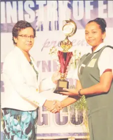 ?? Photo) (Ministry of Education ?? Best speaker Amabel Campbell receiving her trophy from Assistant Chief Education Officer Nursery, Ingrid Trotman.