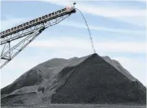  ?? BILL ESTEP bestep@herald-leader.com ?? Coal produced at an undergroun­d mine in Kentucky poured from the end of a conveyor onto a pile being used to load trucks in December 2018.