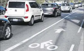  ?? Lawrence K. Ho
Los Angeles Times ?? MATTY SPOKE at the town hall meeting about the controvers­ial “Rowena Road diet,” which reduced the number of car lanes and added bike lanes.