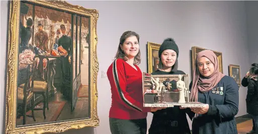  ?? COLE BURSTON PHOTOS FOR THE TORONTO STAR ?? From left, Nadine Addada, Jing Poli and Carisa Antoriksa with their interpreta­tion of James Tissot's La Demoiselle de Magasin.