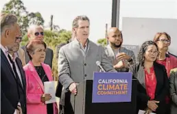  ?? Rich Pedroncell­i / Associated Press ?? Legislatio­n signed by Gov. Gavin Newsom, shown at Mare Island in Vallejo last month, requires the state to become carbon-neutral by 2045.