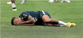  ?? AP ?? Even in training, Brazilian star Neymar in apparent agony. can’t help but collapse on the ground