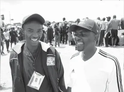  ??  ?? Michael Moyo shares a lighter moment with his headmaster Khumbulani Sibanda at White City Stadium yesterday