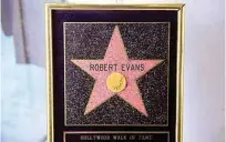  ??  ?? Robert Evans’s Hollywood Walk of Fame Star which he received in May 2003 (est. $3,000-$5,000) is displayed during an auction preview of “Property from the Estate of Robert Evans” .