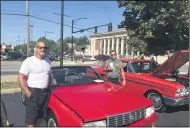  ?? MICHAEL FITZPATRIC­K—THE MORNING JOURNAL ?? Owner Bruce Schlosser and his friend, Donnie Novosieles­ki stand by a bright red Cadillac convertibl­e at a car show at
Elyria Apple Festival in Elyria.