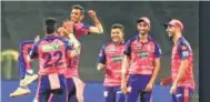  ?? ?? RR players celebrate after they successful­ly defended a below-par total of 144-8 in their IPL match against RCB, in Pune, on Tuesday