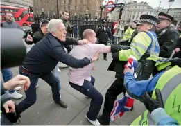  ?? AFP ?? Pro-Brexit protestors scuffle with the police during a demonstrat­ion in central London —