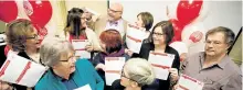  ?? JASON BAIN/EXAMINER ?? The Peterborou­gh and District United Way team displays its report card revealing the results of the 75th anniversar­y campaign handed out at a celebratio­n at the Holiday Inn on Thursday. The 2016 community campaign raised $1.82 million, 91 per cent of the goal.