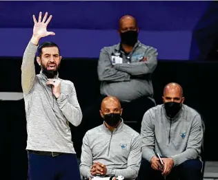  ?? Marcio Jose Sanchez / Associated Press ?? Hornets coach James Borrego, left, found out Sunday he may be without Lamelo Ball, his best player, because of a broken wrist suffered in their most recent game on Saturday.