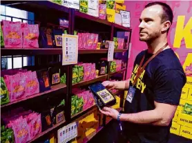  ?? Jari Tanner/Associated Press ?? Kaffa Roastery’s founder Svante Hampf shows package of “AI-conic” coffee blend generated by artificial intelligen­ce in Helsinki, Finland on Friday.