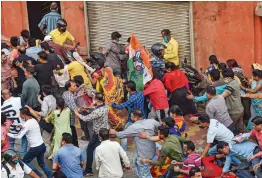  ?? — PTI ?? Trinamul Congress workers run away after a clash with BJP workers during a BJP roadshow for upcoming polls in Kolkata on Wednesday.