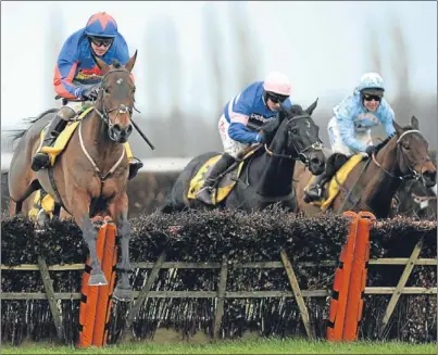  ?? Picture: PA. ?? Splash Of Ginge, left, negotiates the last on his way to victory in the Betfair Hurdle at Newbury on Saturday.