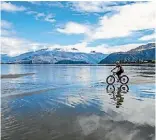 ?? JOHAN LOLOS / SUPPLIED ?? Fat bikes can ride into just about any type of terrain, including the shallows of Lake Wanaka.